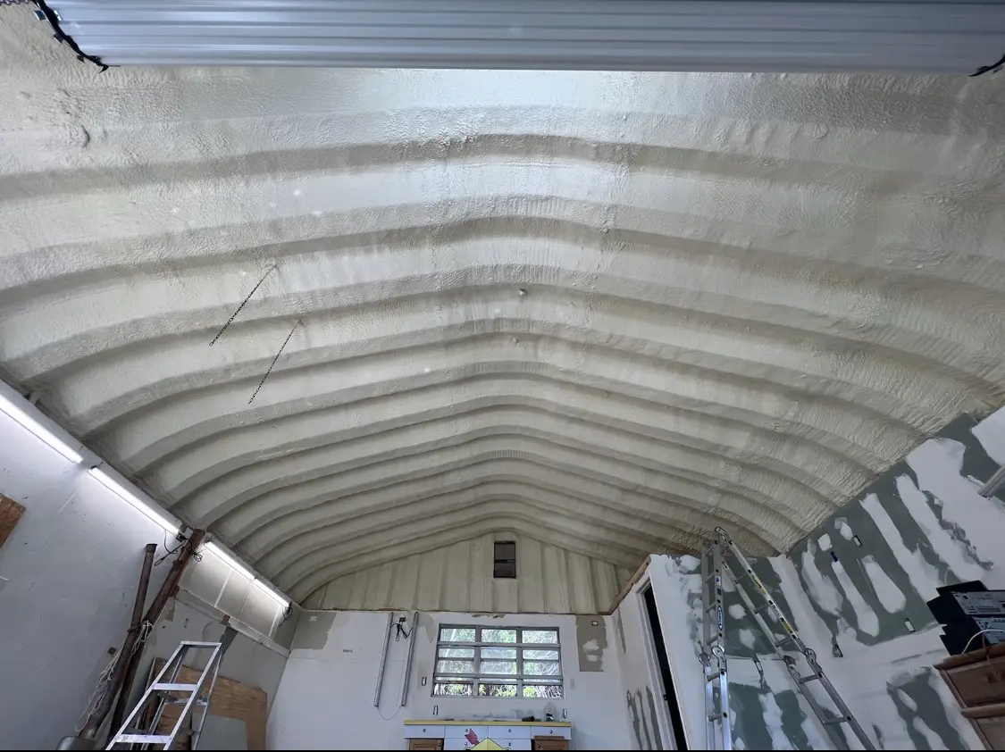 Spray polyurethane foam applied to the underside of a metal roof deck in Lewisburg